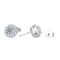 Silver earrings with clear gemstones on a white background