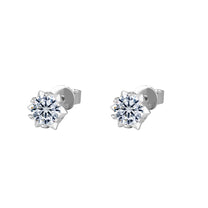 Pair of diamond stud earrings on a white background