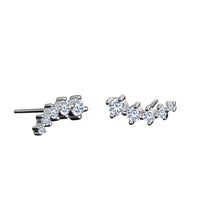 Pair of silver earrings with clear gemstones on a white background