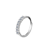 Silver ring with small diamonds on a white background