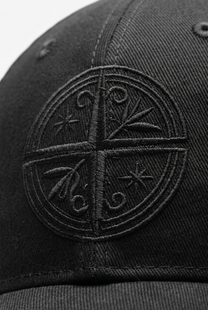 Black cap with a detailed compass embroidered
