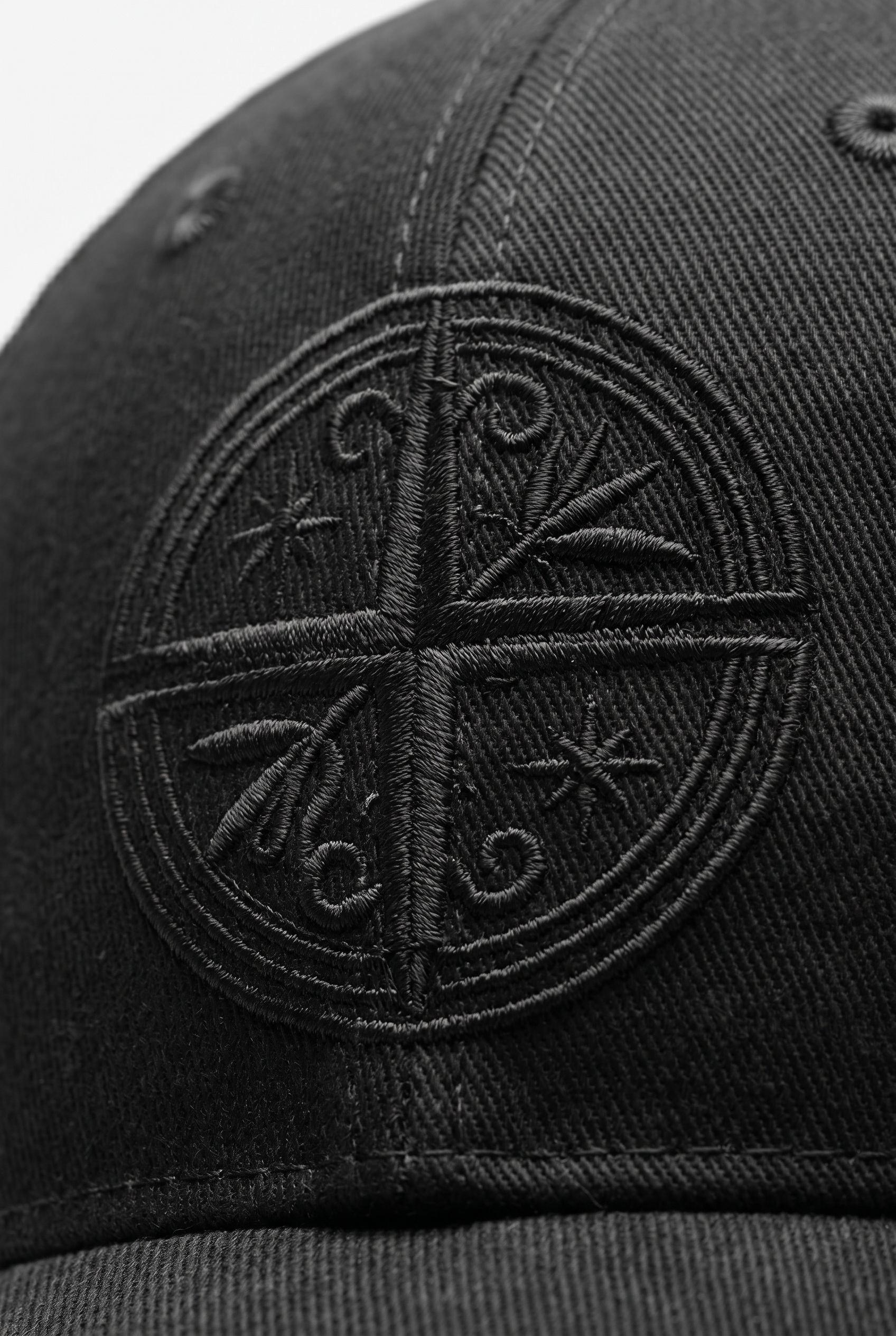 Black cap with a detailed compass embroidered